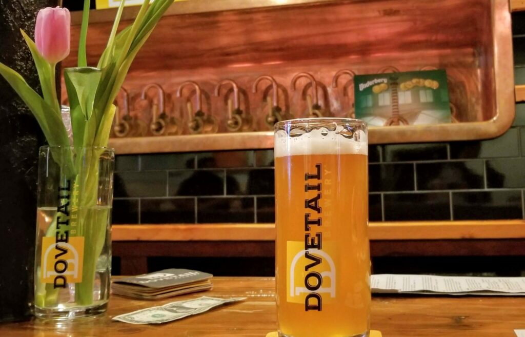 A glass of beer at the bar at Dovetail Brewery, one of the best breweries in Chicago.