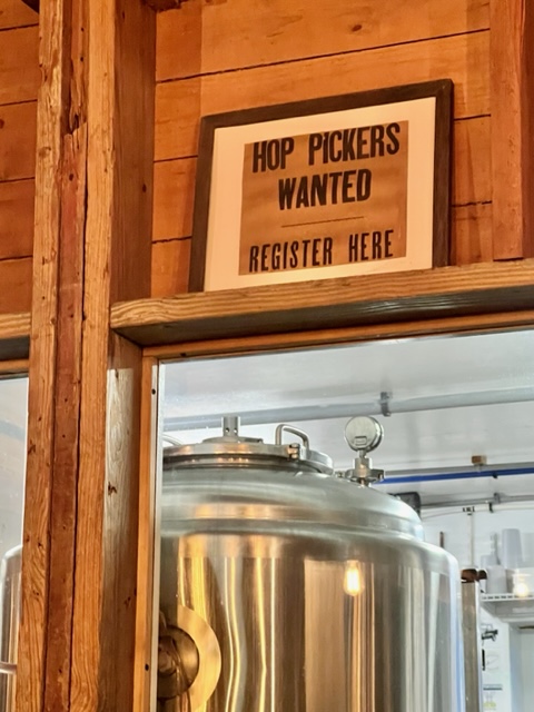 "Hop Pickers Wanted" sign to Emancipation Brewing.